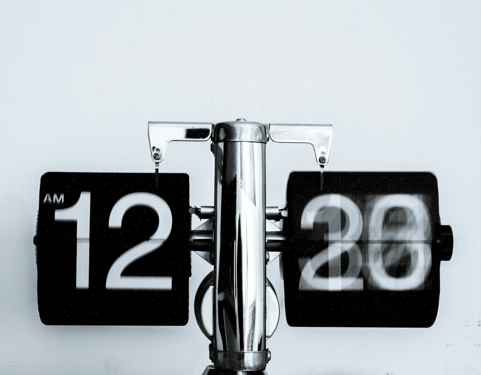 A flip clock displaying the time, representing the wait time for an Instagram data export