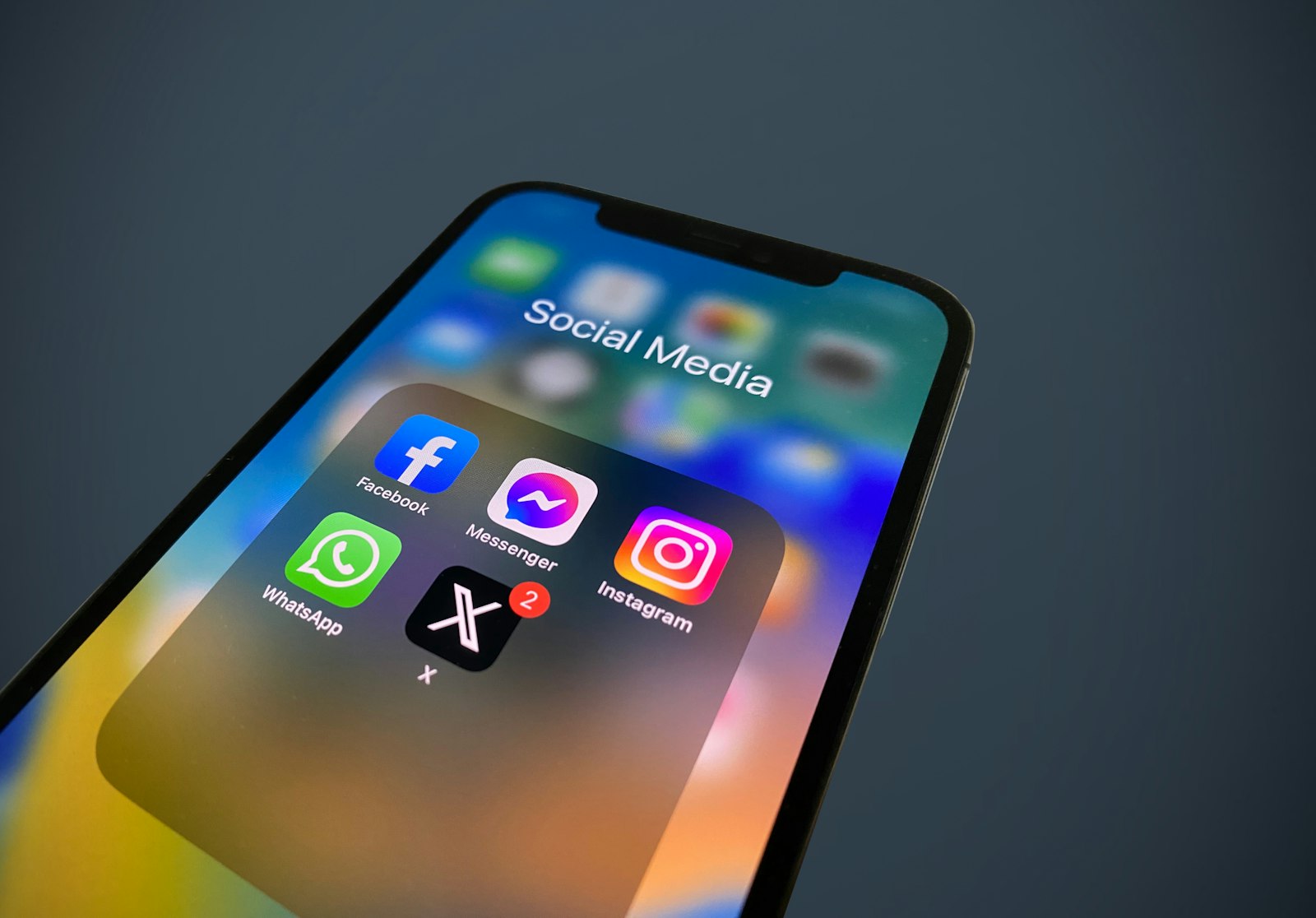 A close-up of a smartphone showing social media app icons, representing an Instagram unfollow checker tool
