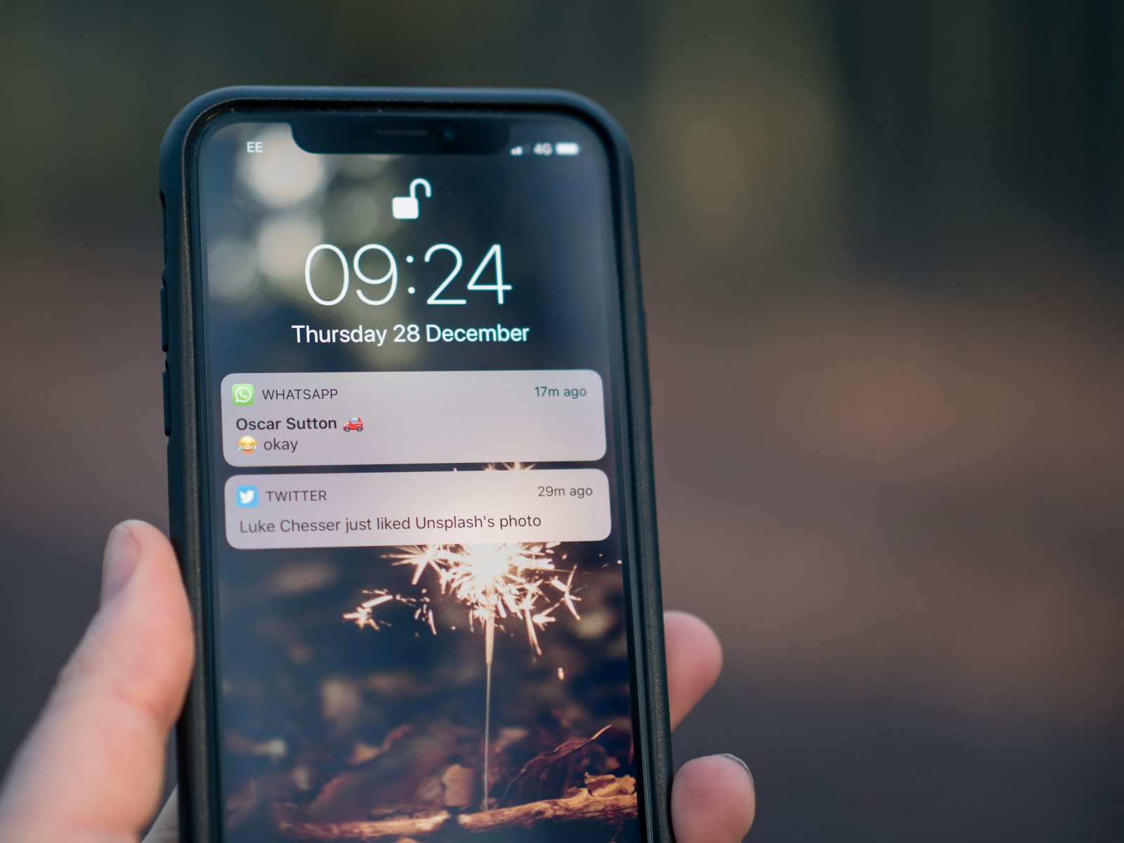 A phone lock screen showing push notifications from messaging and social apps