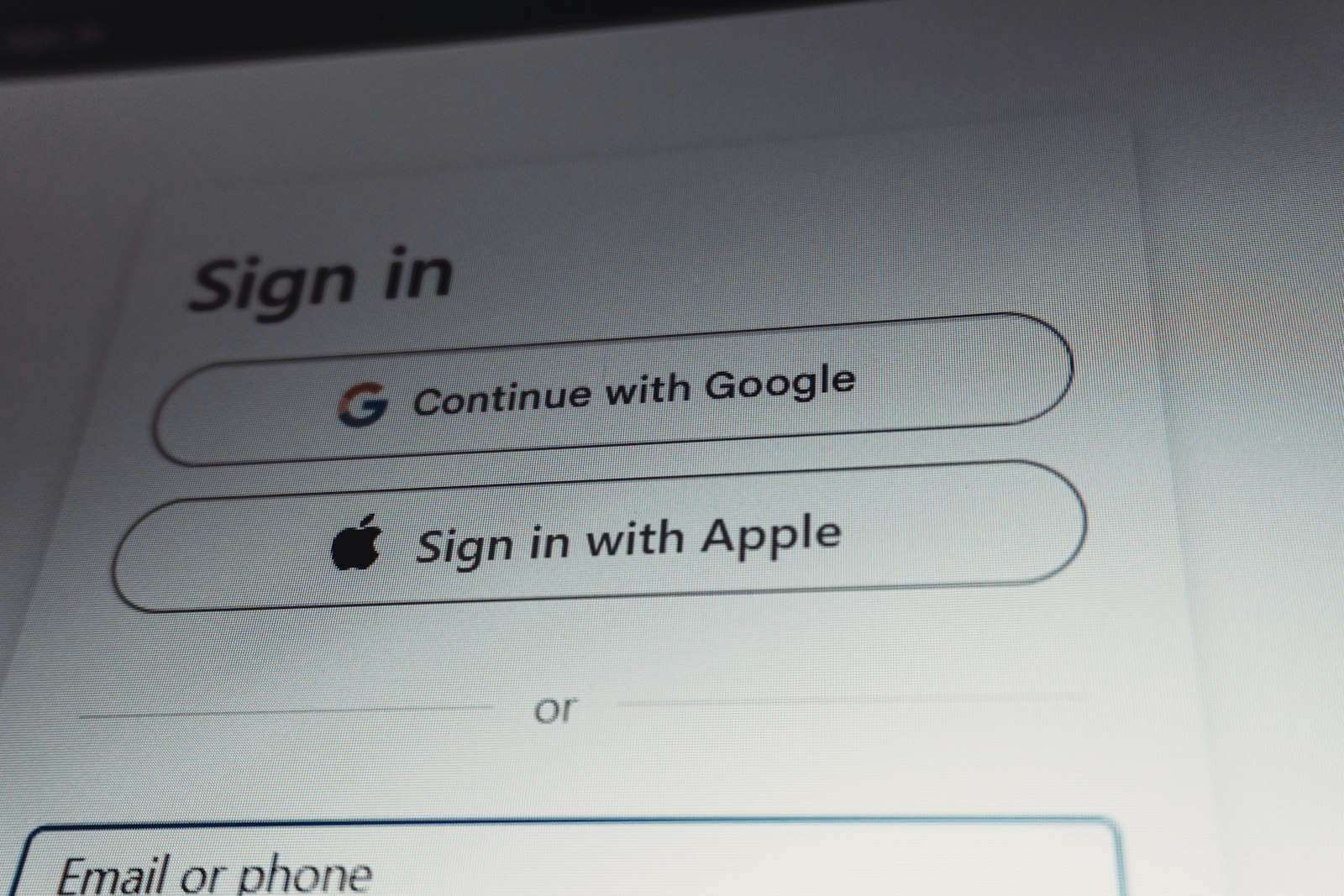 A sign-in screen offering Continue with Google and Sign in with Apple